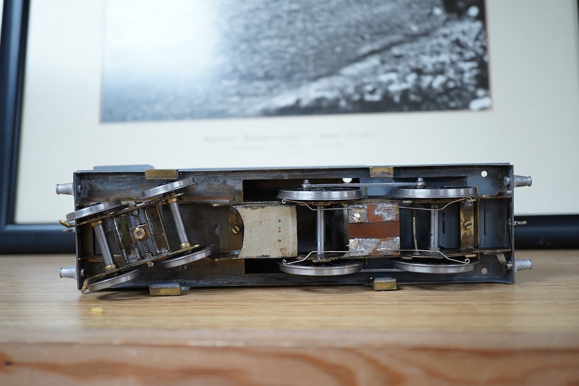 Eleven 0 gauge model railway items including; a bogie stake wagon, two mineral wagons, a North British coal wagon and two further open wagons, a partly constructed brake van, together with a Lima LMS 4F locomotive, two L